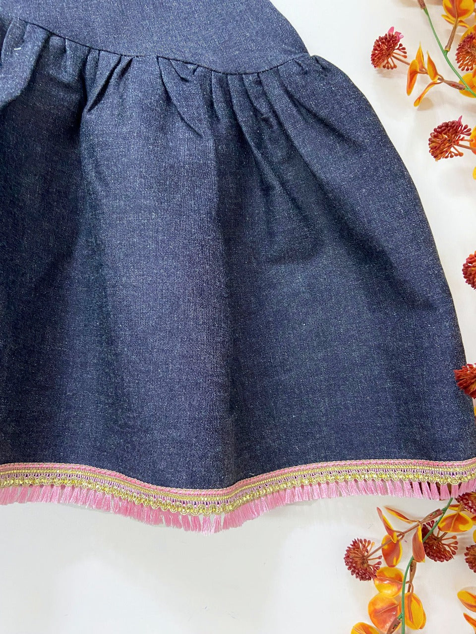 Denim dress with pink frills design